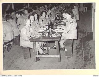 LAE AREA, NEW GUINEA. 1945-07-02. THE SERGEANTS' MESS, AUSTRALIAN WOMEN'S ARMY SERVICE BARRACKS ON THE OCCASION OF THE FIRST FORMAL MESS HELD BY AUSTRALIAN WOMEN'S ARMY SERVICE SERGEANT SIN NEW ..