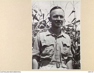 LAE, NEW GUINEA. 1945-11-3. SERGEANT T.D. CHAPPLE, CAMP INTERPRETER, 20 PRISONER OF WAR CAMP, LAE. HE ACQUIRED A WORKING KNOWLEDGE OF JAPANESE WHILST ENGAGED IN THE PEARLING INDUSTRY AT BROOME, ..