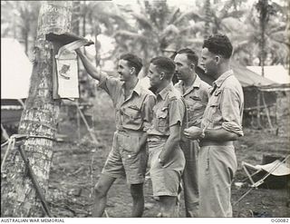 PORT MORESBY, PAPUA. C. 1943-07. TWO BEAUFIGHTER CREWS OF NO. 30 SQUADRON RAAF WHO PICKED UP A JAPANESE CAMOUFLAGED SUPPLY SHIP DURING AN ATTACK ON JAPANESE INSTALLATIONS AT JACQUINOT BAY, NEW ..