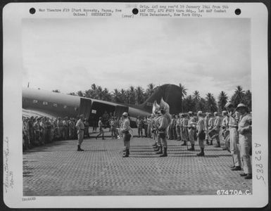 The 32nd Division Band participated in the reception for Gary Cooper and party on their arrival in Port Moresby, Papua, New Guinea, during their tour of the Pacific Islands. 7 December 1943. (U.S. Air Force Number 67470AC)