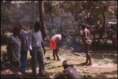 Malaria Control Service national staff prepare an earth oven for a party (4) : Papua New Guinea, 1976-1978 / Terence and Margaret Spencer