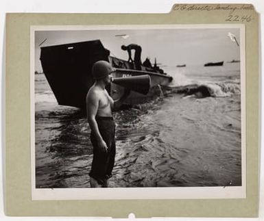 Coast Guardsman Directs Landing Boats In Invasion