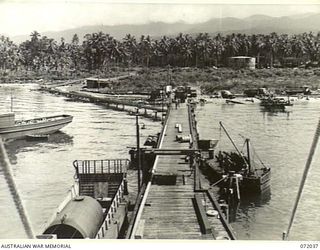 MILNE BAY, NEW GUINEA. 1944-04-04. PIPE LINES LEAD FROM THE OIL WHARF TO STORAGE INSTALLATIONS AT THE 2ND AUSTRALIAN BULK PETROLEUM STORAGE COMPANY