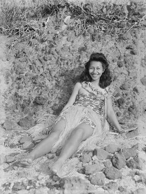 [Portrait of a Polynesian woman in a coastal setting]