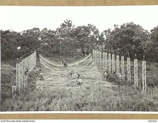 LANGWARRIN, AUSTRALIA. 1943-04. FULL LENGTH VIEW OF THE PREPARED CATCHMENT AREA USED IN AN EXPERIMENT, UNDER CONDITIONS SIMILAR TO THOSE ENCOUNTERED IN NEW GUINEA, IN SUPPLY-DROPPING FROM AIRCRAFT, ..