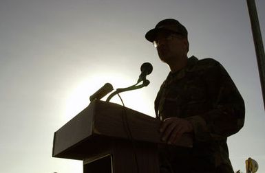 Silhouette of US Air Force (USAF) Colonel (COL) Joe Mudd, Commander, 36th Air Base Wing (ABW), speaks at a ground breaking ceremony for a new Security Forces operational building at Andersen Air Force Base (AFB), Guam