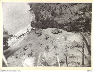 KANGU HILL, BOUGAINVILLE. 1945-10-05. AUSTRALIAN NEW GUINEA ADMINISTRATIVE UNIT HEADQUARTERS ON KANGU HILL, USED FOR THE REHABILITATION OF NATIVES IN THE SOUTH OF BOUGAINVILLE. THE CLEARING WAS THE ..