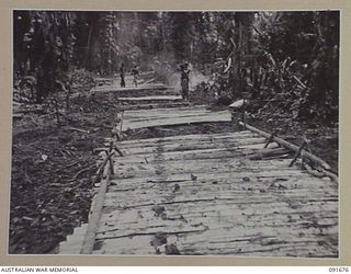 SORAKEN AREA, BOUGAINVILLE. 1945-05-04. MEN OF 16 FIELD COMPANY, ROYAL AUSTRALIAN ENGINEERS, WORKING ON THE CONSTRUCTION OF THE EAST WEST TRAIL. THE ROAD, MEASURING APPROXIMATELY 4,400 YARDS, RUNS ..