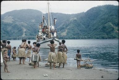 The vessel leaves, note the discarded bush stretchers which were used to carry the patients : Goodenough Island, D'Entrecasteaux Islands, Papua New Guinea, 1956-1958 / Terence and Margaret Spencer