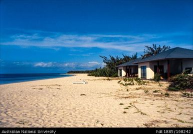 New Caledonia - Ouvéa - white beachside apartments, tiled roofs