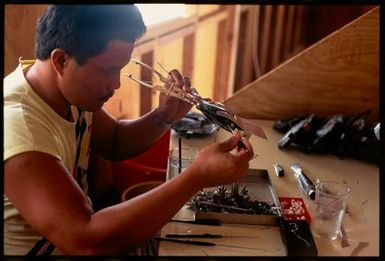 Pearl technician seeding an oyster, Manihiki, Cook Islands