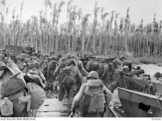 New Britain. 15 December 1943. US troops disembark from landing barges in the early hours of the morning, in one of the most daring assaults yet undertaken in the Pacific, on the southern coast ..