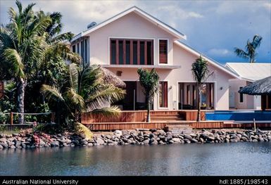 Fiji - waterside buildings, stone retaining wall