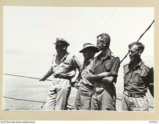 BUT AREA, NEW GUINEA. 1945-02-26. OBSERVATION OFFICERS OF THE 4TH TACTICAL RECONNAISSANCE UNIT, 6TH DIVISION, WATCHING THE BOMBARDMENT BY THE RAN VESSEL HMAS SWAN ON THE JAPANESE POSITIONS IN THE ..