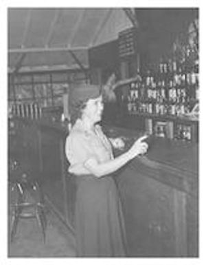 Lucy Slade Libby orders a drink at a bar
