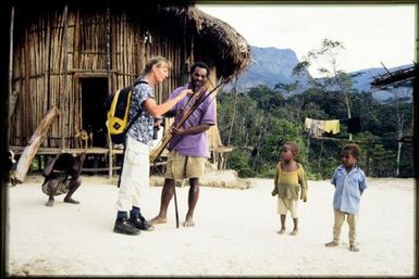 Viv Whitaker with locals in village