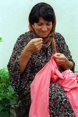 A Kurdish woman passes time sewing while outside her temporary residence at Andersen Air Force Base, Guam, as part of Operation PACIFIC HAVEN. The operation, a joint humanitarian effort conducted by the US military, entails the evacuation of over 2,100 Kurds from northern Iraq to avoid retaliation from Iraq for working with the US government and international humanitarian agencies. The Kurds will be housed at Andersen AFB, while they go through the immigration process for residence in the United States