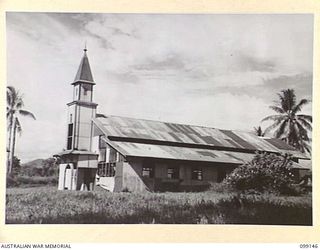 LAE, NEW GUINEA. 1945-11-26. THE BUTIBUM MISSION CHURCH, FORMERLY CONTROLLED BY THE LUTHERAN MISSION SOCIETY. IT WAS USED BY THE JAPANESE AS A HOSPITAL AND LATER, AS AN AUSTRALIAN DISPATCH RIDER ..