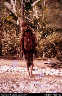 Woman with produce and baby