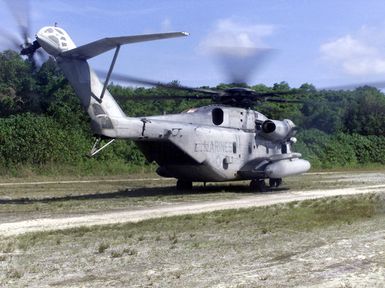 A CH-53E Super Stallion helicopter from HMH-463 Kaneohe Bay, Hawaii, lands on the island of Peleliu as part of Exercise KOA THUNDER 2001. Marines from Aviation Support Element, Kaneohe Bay Hawaii, 1ST Marine Air Wing (MAW), Okinawa Japan, and 3rd Marines 7th Battalion 29 Palms, California, participated in KOA THUNDER on the island of Guam from July 9 to July 14. The purpose of the exercise was to demonstrate the Marine Corps ability to deploy in the South Pacific from places other than Okinawa, Japan