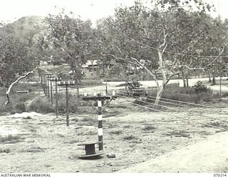 PORT MORESBY, NEW GUINEA. 1944-02-07. AN ELECTRIC MESSAGE CONVEYOR VIEWED FROM THE 18TH LINES OF COMMUNICATION SIGNALS OFFICE ON ITS RETURN FROM THE HEADQUARTERS, NEW GUINEA FORCE MESSAGE CENTRE, A ..