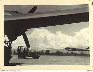 LAE, NEW GUINEA, 1944-03-27. DOUGLAS C47 DAKOTA TRANSPORT AIRCRAFT OF THE UNITED STATES ARMY AIR FORCE AT THE LAE AERODROME