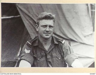 WEWAK AREA, NEW GUINEA. 1945-06-28. CORPORAL R.W. BERG, 6 MILITARY HISTORY FIELD TEAM ATTACHED HEADQUARTERS 6 DIVISION