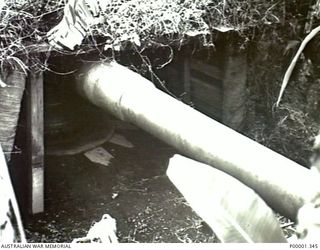 NEW BRITAIN, 1945-09. A CLOSE-UP OF THE FRONT OF A JAPANESE NAVAL GUN POSITION ON THE GAZELLE PENINSULA. (RNZAF OFFICIAL PHOTOGRAPH.)