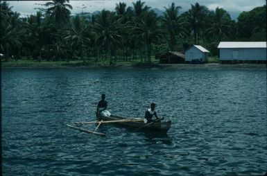 Coastline and Islanders in a canoe (2) : Bougainville Island, Papua New Guinea, 1960 / Terence and Margaret Spencer