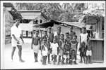 Man and large group of children