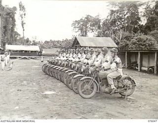 LAE, NEW GUINEA. 1944-09-21. MEMBERS OF THE NEW GUINEA FORCE PROVOST COMPANY MOTOR CYCLE PATROL ON PARADE. IDENTIFIED PERSONNEL ARE:- CORPORAL G.M. CAMERON (1); SERGEANT A.J. DENSMORE (2); CORPORAL ..