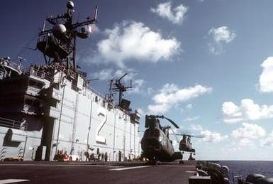 A port view of the island aboard the amphibious assault ship USS SAIPAN (LHA-2). CH-46 Sea Knight helicopters are on deck. The SAIPAN is taking part in exercise Ocean Venture '81