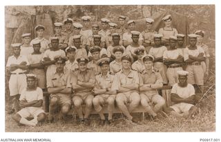 Group portrait of the ship's company of the stores carrier HMAS Matafele, a British ship which was taken over and commissioned by the RAN at sea on 1 January 1943. The ship's motto was 'Wok dasol ..