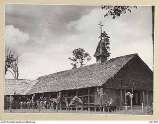 LAE, NEW GUINEA, 1945-05-09. THE GARRISON CHAPEL AT HEADQUARTERS FIRST ARMY DURING THE CHURCH OF ENGLAND AND OTHER PROTESTANT DENOMINATIONS THANKSGIVING SERVICE HELD TO MARK THE END OF HOSTILITIES ..