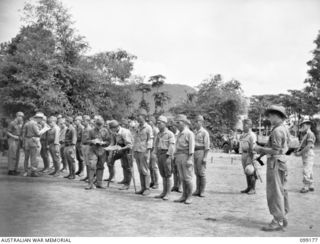 RABAUL, NEW BRITAIN, 1945-11-30. SUSPECTED JAPANESE WAR CRIMINALS LINED UP AT THE CHINESE ARMY CAMP NEAR VULCAN, FOR AN IDENTIFICATION PARADE