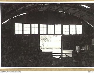 PORT MORESBY, NEW GUINEA. 1943-12-06. AN "ARMCO" STORAGE HUT IN THE COURSE OF CONSTRUCTION FOR NO. 2 SUB DEPOT, 10TH AUSTRALIAN ADVANCED ORDNANCE DEPOT