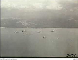 IN FLIGHT OVER BOUGAINVILLE ISLAND, SOLOMON ISLANDS. 1945-01-17. PHOTOGRAPH TAKEN FROM A WIRRAWAY AIRCRAFT OF NO. 5 (ARMY CO-OPERATION) SQUADRON RAAF WHICH ALSO ACT AS PATHFINDERS TO ROYAL NEW ..