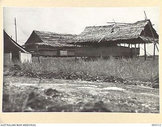 CAPE WOM, WEWAK AREA, NEW GUINEA, 1945-06-13. THE MESS HUT (1) AND LIVING QUARTERS (2) OF MAJ-GEN J.E.S. STEVENS, GOC 6 DIVISION AT HQ 6 DIVISION