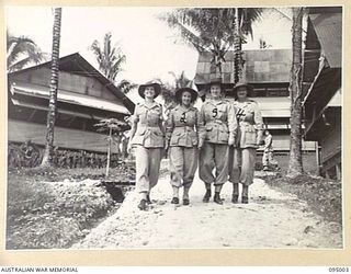 PALMALMAL, NEW BRITAIN. 1945-08-18. MAJOR M.O. WHEELER (1); LIEUTENANT COLONEL E. MCQUADE-WHITE, PRINCIPAL MATRON (2), AND COLONEL A.M. SAGE, MATRON IN CHIEF (4), WITH GRACIE FIELDS (3), AT 2/8 ..