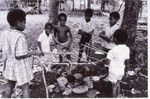 Children at play building a cooking house