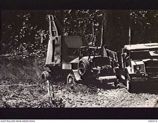 REINHOLD HIGHWAY, NEW GUINEA, 1943-09-03. MECHANICAL SHOVEL WORKING AT THE 8 1/4 MILE POINT FROM BULLDOG