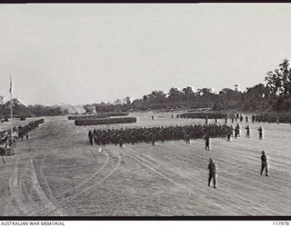 TOROKINA, BOUGAINVILLE. 1945-10-29. PERSONNEL OF 24TH INFANTRY BATTALION GIVE EYES RIGHT TO THE COMMANDER IN CHIEF, AUSTRALIAN MILITARY FORCES, DURING THE MARCH PAST OF 3RD DIVISION ON THE PIVA ..