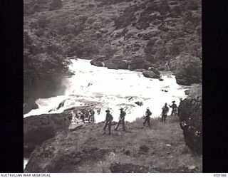 LALOKI VALLEY, NEW GUINEA. 1943-11-05. A PATROL FROM THE NEW GUINEA FORCE TRAINING SCHOOL (JUNGLE WING) ON AN EXERCISE NEAR THE ROUNA FALLS