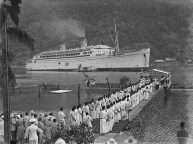 [Arrival ceremony on Pacific island jetty for passenger ship]