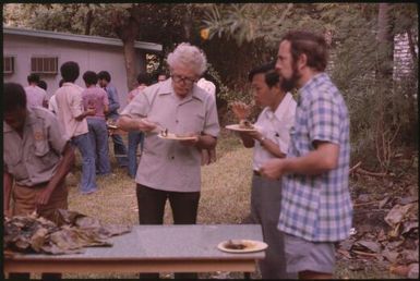 The party (Dr Nathaniel Tavil, director of the Dept of Public Health, in the centre). : Papua New Guinea, 1976-1978 / Terence and Margaret Spencer