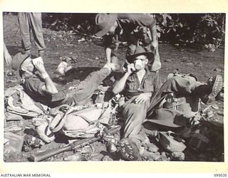 WIHIBI RIVER, NEW GUINEA, 1945-08-04. MEMBERS OF 2/7 BATTALION SET OUT ON A SIX DAY TREK TO ENEMY TERRITORY. THE PREVIOUS DAY YMCA REPRESENTATIVE, MR K. HILLIS, WENT FORWARD TO A HALFWAY POINT FOR ..