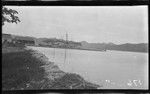 Distant view of ship and buildings