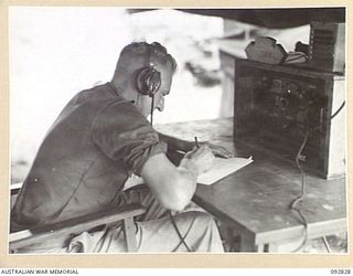 WEWAK AREA, NEW GUINEA. 1945-06-05. SERGEANT E. ROBERTS, 3 MOBILE METEOROLOGICAL FLIGHT, RAAF, ATTACHED HEADQUARTERS ROYAL AUSTRALIAN ARTILLERY 6 DIVISION, OPERATING THE NO. 4 AUSTRALIAN RECEIVING ..