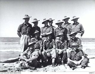 BORAM, NEW GUINEA, 1945-11-21. INFORMAL GROUP PORTRAIT OF COMPANY OFFICERS OF 30TH INFANTRY BATTALION