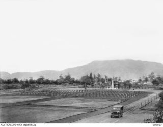 RABAUL, NEW BRITAIN, 1946-03-16. A PANORAMIC VIEW OF THE CHINESE CEMETERY. OF THE 653 CHINESE WHO DIED WHILST CAPTIVES OF THE JAPANESE, 259 WERE RE-INTERRED IN THIS CEMETERY. IT CONTAINS VACANT ..